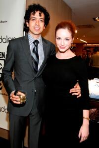 Geoffrey Arend and Christina Hendricks at the Bloomingdale's men's floor re-opening celebration.