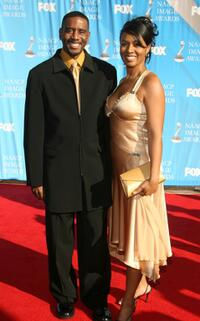 Reggie Gaskins and Guest at the 38th Annual NAACP Image Awards.