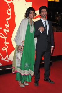 Akin Gazi and Guest at the premiere of "The Devils Double" during the 61st Berlin Film Festival.