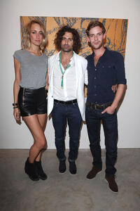 Ruta Gedmintas, artist Todd DiCiurcio and Luke Treadaway at the Todd DiCiurcio "Gold" Exhibition in London.