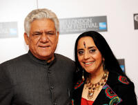 Om Puri and Ila Arun at the photocall of "West Is West" during the 54th BFI London Film Festival.