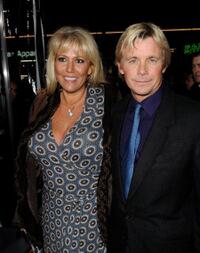 Christopher Atkins and Guest at the premiere of "Extraordinary Measures."