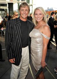 Christopher Atkins and Guest at the premiere of "The Ugly Truth."