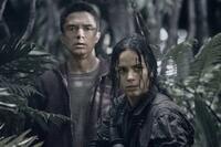Topher Grace as Edwin and Alice Braga as Isabelle in "Predators."