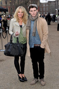 Laura Haddock and Sam Claflin at the Burberry Prorsum Show during the London Fashion Week Autumn/Winter 2011.