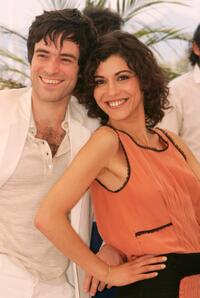 Romain Duris and Lubna Azabal at the photocall of "Exils" during the 57th Cannes Film Festival.
