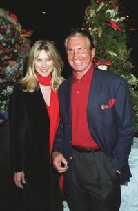 George Hamilton and Alana Stewart pose for a picture during "Merv Griffins 7th Annual Christmas Tree Lane Lighting Ceremony and Live Auction of Trees".