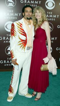 Ben Harper and Laura Dern at the 47th Annual Grammy Awards.