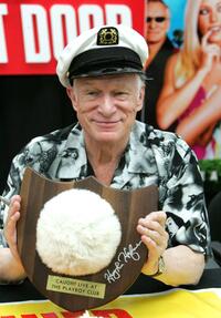 Hugh Hefner poses at the DVD signing of "Hugh Hefner and the Girls Next Door."