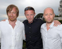 Morten Tyldum, Jo Nesbo and Aksel Hennie at the photocall of "Headhunters" during the 64th Locarno Film Festival: Day 2.