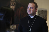 Evan Helmuth as Fr. David Keane in ``The Devil Inside.''