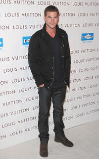 Liam Hemsworth at the opening of "Louis Vuitton Santa Monica To Benefit Heal The Bay" in California.