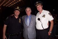 Charlton Hestonand and two New York City Police officers at the premiere of "Planet of the Apes" at the Ziegfield Theatre in New York City.