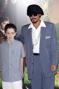 Freddie Highmore and actor Johnny Depp at the UK Premiere of "Charlie And The Chocolate Factory."