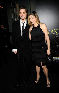 Christopher Backus and Mira Sorvino at the Giorgio Armani 5th Avenue Store Opening Reception in New York.