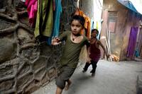 Ayush Mahesh Khedekar and Azharuddin Mohammed Ismail in "Slumdog Millionaire."