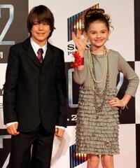 Liam James and Morgan Lily at the premiere of "2012."