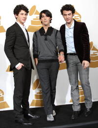 Nick Jonas, Joe Jonas and Kevin Jonas at the press room during the Grammy Nominations concert live.