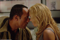 Dwayne Johnson as Boxer Santaros and Mandy Moore as Madeline Frost Santaros in "Southland Tales."