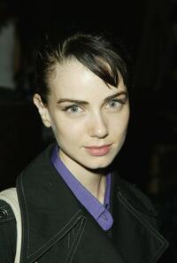Mia Kirshner poses at the Cafe La Boheme for a Fashion Week event.