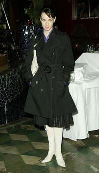 Mia Kirshner poses at the Cafe La Boheme for a Fashion Week event.