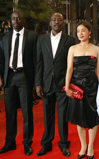 Diouc Koma, director Mahamat-Saleh Haroun and Heling Li at the premiere of "Un Homme Qui Crie" (A Screaming Man) during the 63rd Cannes Film Festival.