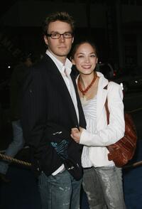Kristin Kreuk and her guest at the premiere of "Poseidon."