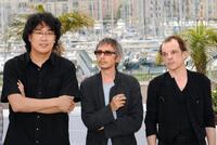 Bong Joon Ho, Leos Carax and Denis Lavant at the screening of "Tokyo" during the 61st Cannes International Film Festival.