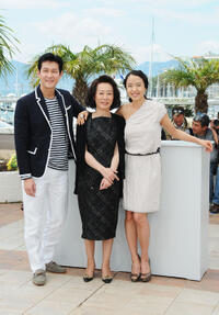 Lee Jung-Jae, Youn Yuh-jung and Jeon Do-yeon at the photocall of "The Housemaid"  during the 63rd Annual Cannes Film Festival in France.