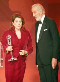 Christopher Lee and Catherine Deneuve at the ceremony of the Women's World Awards 2005.