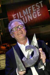 Barry Levinson at the Munich film festival with his CineMerit Award trophy.
