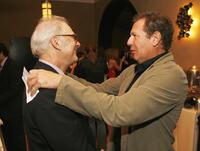 Barry Levinson and Garry Shandling talk at the Hollywood Roosevelt Hotel for the afterparty at the premiere of Universals "Man of the Year".