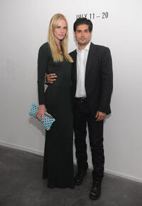 Model Anne Vyalitsyna and Andrew Levitas at the "Metal Works Photography: Sculptures."