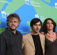 Director Andrea Porporati, Luigi Lo Cascio and Donatella Finocchiaro at the photocall of "I! Dolce E L'Amaro" during the 64th Venice International Film Festival.