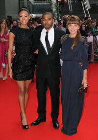 Shanika Warren-Markland, Noel Clarke and Ophelia Lovibond at the Red Carpet of National Movie Awards 2010 in London.