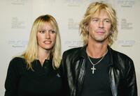 Susan Holmes and Duff McKagan at the Playstation 2 Triple Double Celebrity Gaming Tournament.
