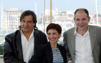 Gerard Meylan, Ariane Ascaride and Jean-Pierre Darroussin at the photocall of "Marie-Jo et Ses Deux Amours" during the 58th International Film Festival.