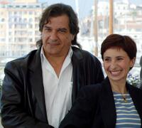 Gerard Meylan and Ariane Ascaride at the photocall of "Marie-Jo et Ses Deux Amours" during the 58th International Film Festival.