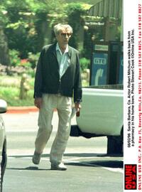 Robert Mitchum walks to his car after visiting his local pharmacy.