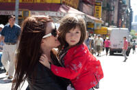 Julianne Moore as Susanna and Onata Aprile as Maisie in "What Maisie Knew."