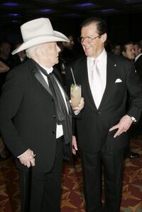 Roger Moore and Tony Curtis at the Sony Ericsson Empire Film Awards.
