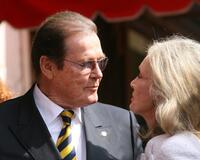 Roger Moore with wife Christina Tholstrup while being honored with a Star on the Walk of Fame.