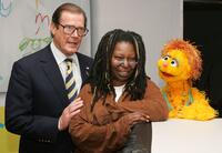 Roger Moore, Whoopi Goldberg and Kami the HIV positive muppet at the UNICEF and Clear Channel ad campaign.