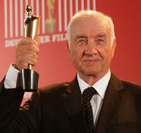 Armin Mueller-Stahl at the German Film Award, holds his Lola Award for Lifetime Achievement.