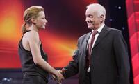 Armin Mueller-Stahl at the Golden Bear Award Gala, congratulates Sandra Hueller.