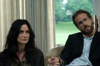 Carrie-Anne Moss and Ryan Reynolds in "Fireflies in the Garden."