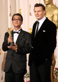Director Yojiro Takita and Liam Neeson at the 81st Annual Academy Awards.