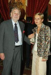 Philippe Noiret poses with Melita Toscan Du Plantier at the Elysee Palace prior to the Cannes Film Festival.