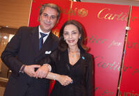 Director of Rome's Cartier Boutique Roberto Grandis and Maria Rosaria Omaggio at the 2009 Cartier Love Day in Rome.