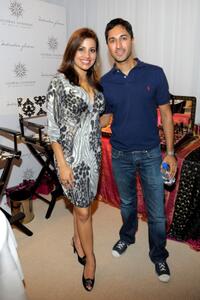Maulik Pancholy and Guest at the HBO Luxury Lounge in honor of the 60th Annual Primetime Emmy Awards.